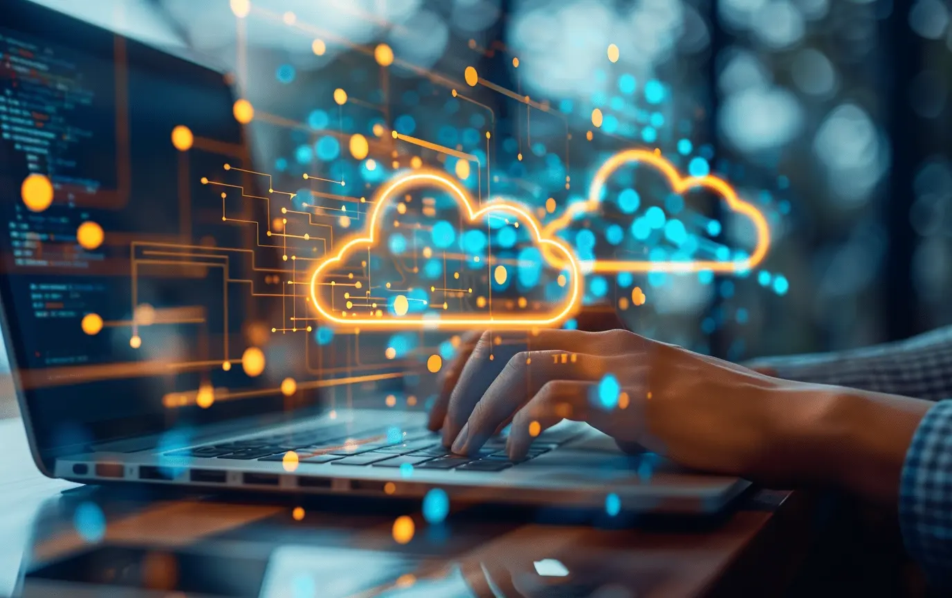 SAAS SEO Services - hands typing on a laptop keyboard with cloud icons floating - Digitech