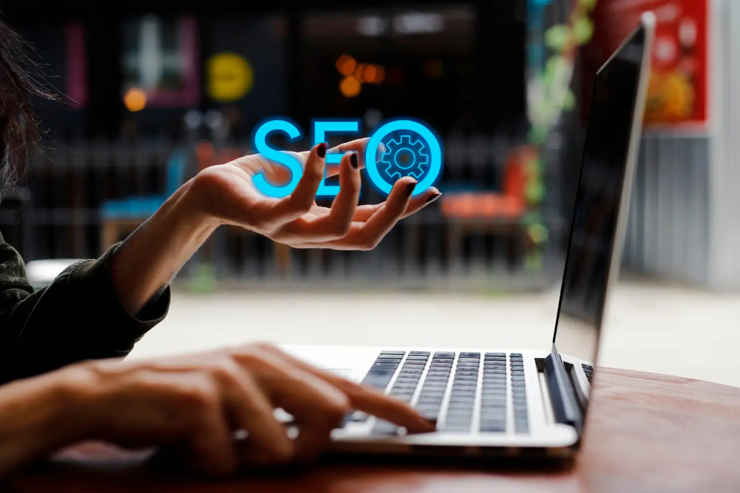 a womans hand holding up the word SEO in ehr palm - digitech